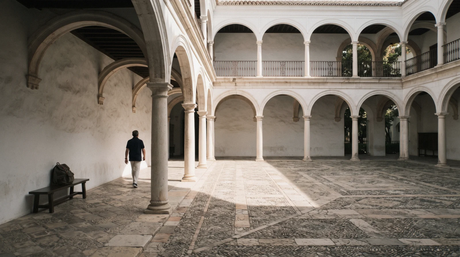 The arcaded courtyard and tower of the Palacio de Villalón on Calle Compañía in soft afternoon light, the Museo Carmen Thyssen Málaga