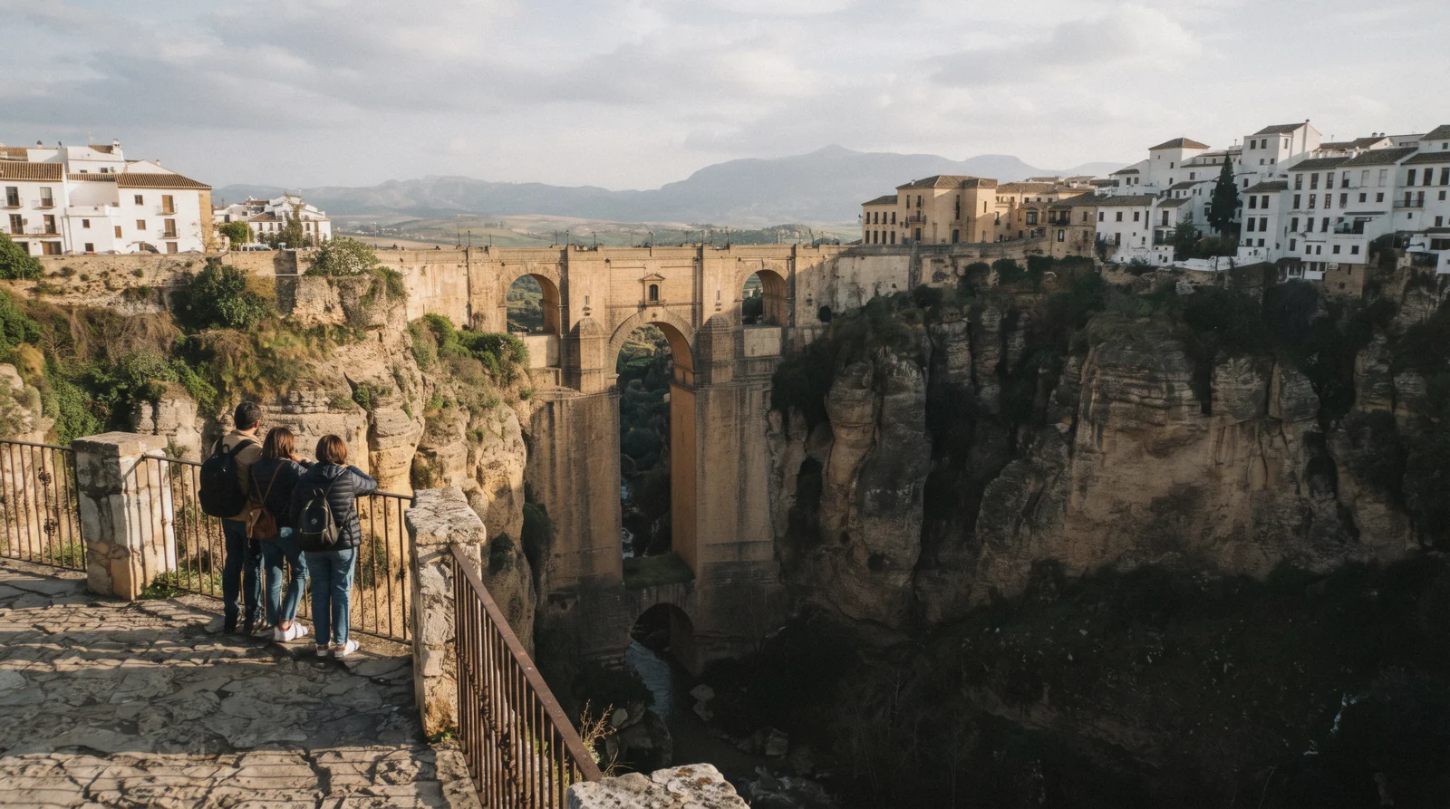 The Puente Nuevo at Ronda from the gorge path in morning light, the most photographed of the day trips from Málaga