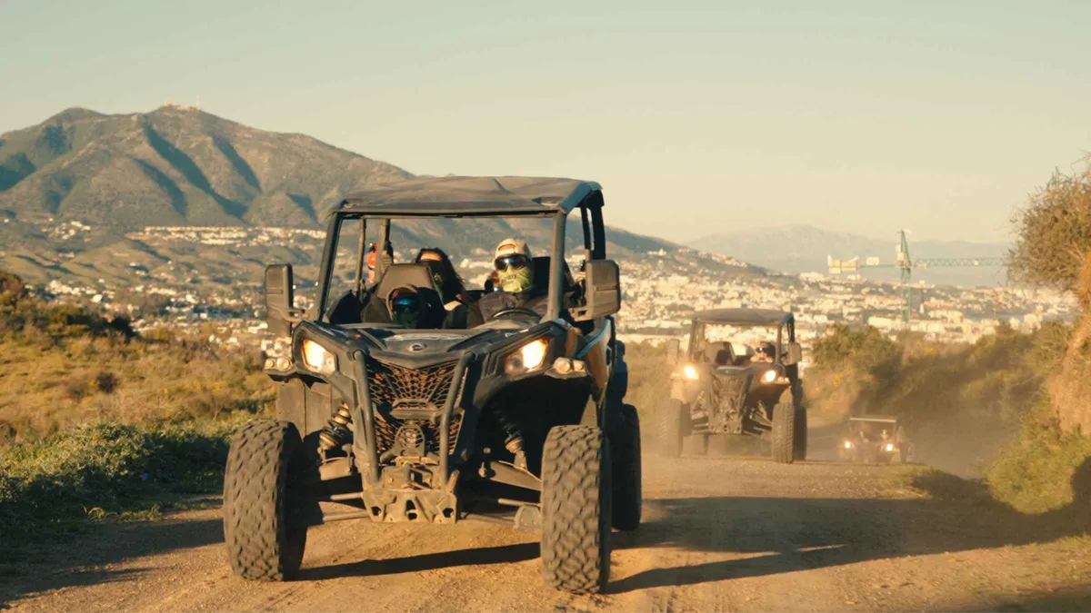 Open off-road buggy on a dusty mountain track in the Sierra de Mijas on a buggy tour near Málaga