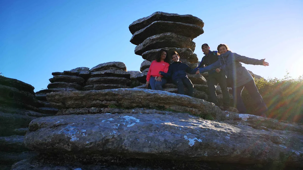 Hikers among the stacked limestone karst of El Torcal de Antequera on a guided hike from Málaga