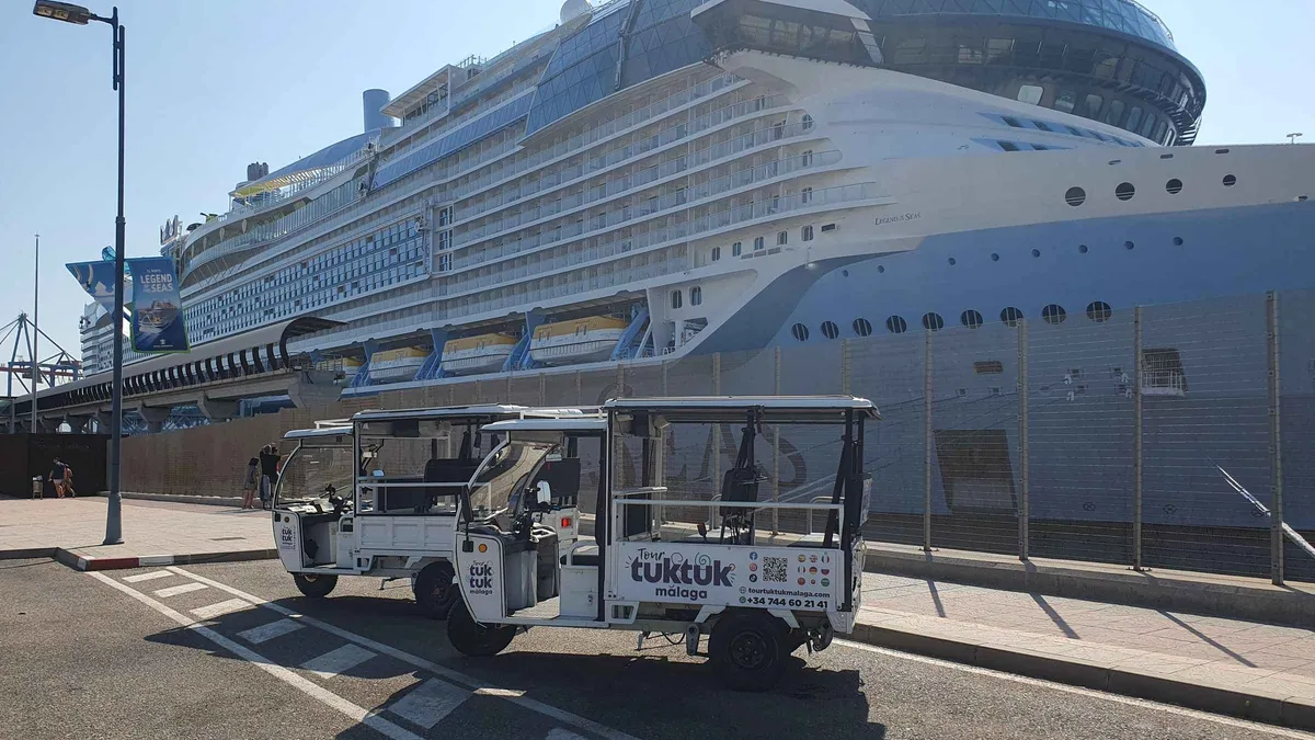 Electric tuk tuk parked at the Mirador de Gibralfaro above the port on a cruise terminal tour of Málaga