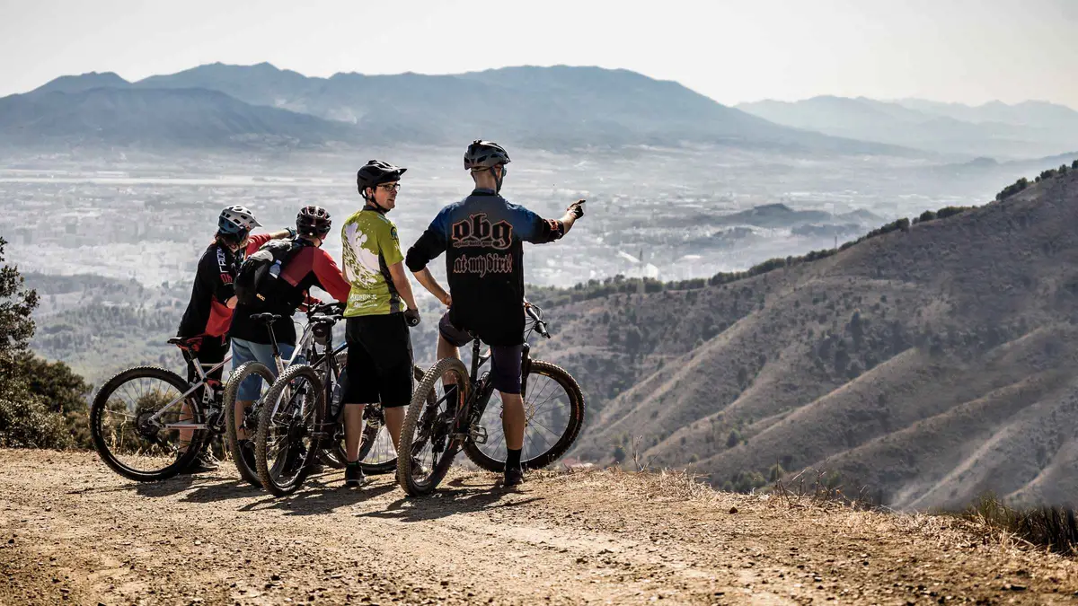 E-mountain bikes on a pine forest track with a view over the bay on an e-bike tour of the Montes de Málaga