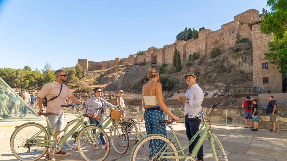 Row of vintage bicycles outside Atarazanas Market with a guide, vintage bike tour of highlights and coast in Málaga
