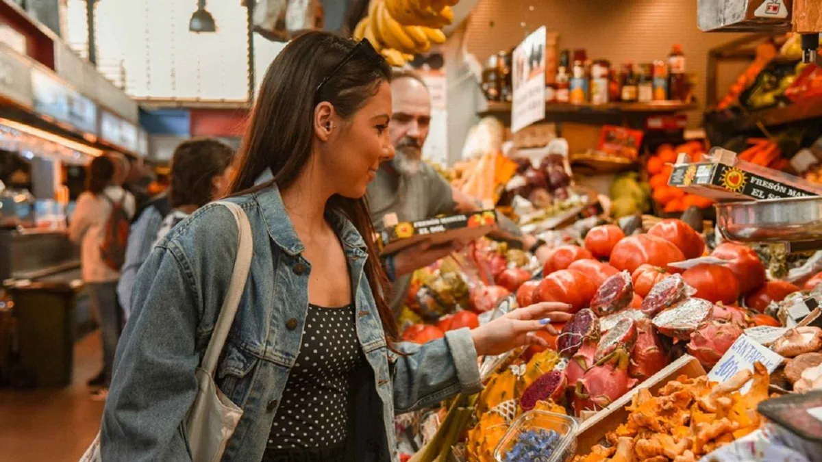 Fresh fish and produce stalls inside Atarazanas market on a guided food tour in Malaga