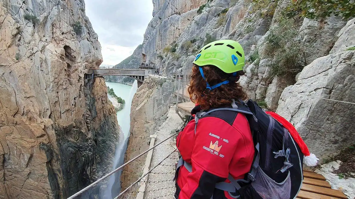 Walkers on the cliff-side boardwalk above the Gaitanes gorge on a Caminito del Rey tour from Malaga
