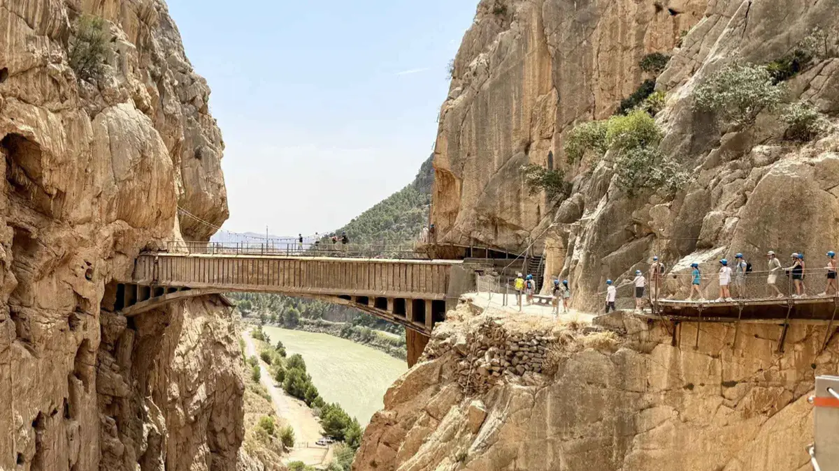 Shaded section of the Caminito del Rey boardwalk in late afternoon on a tour from Malaga