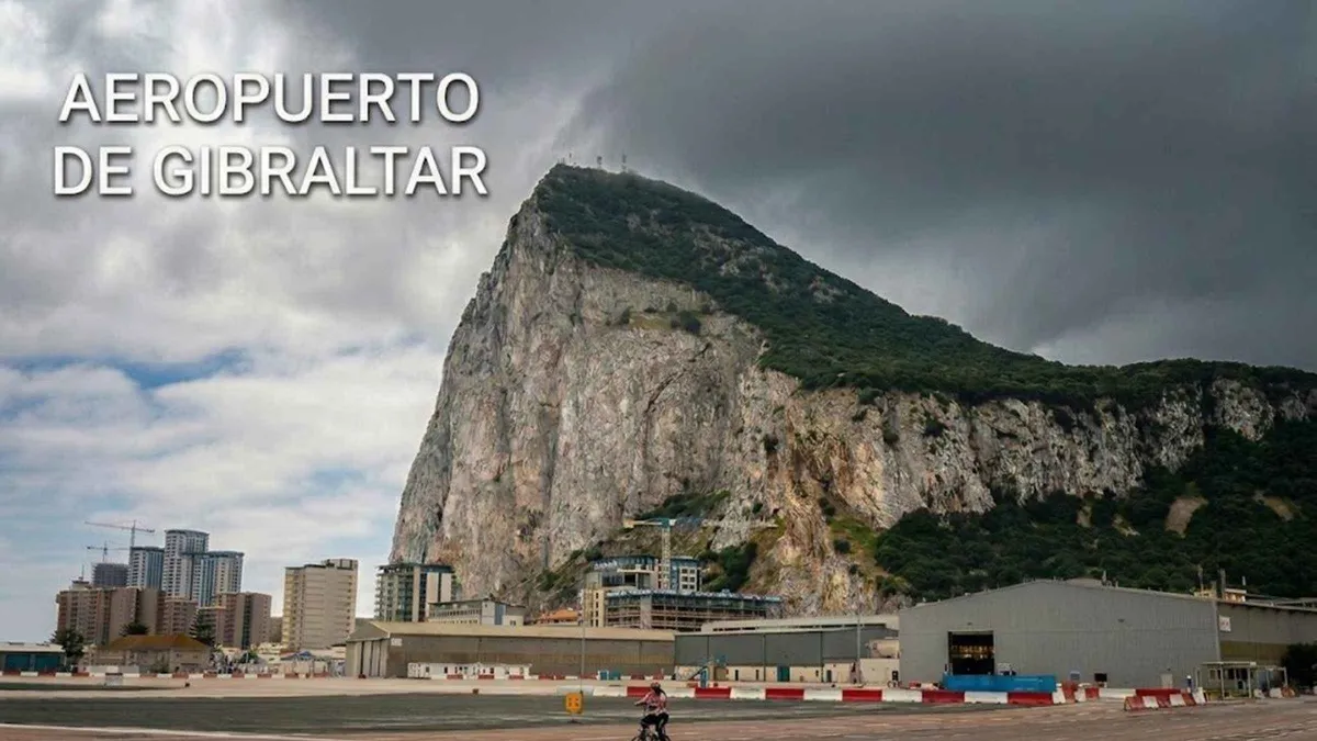 Pedestrians crossing the Gibraltar airport runway on foot on a five-hour Gibraltar day trip from Málaga