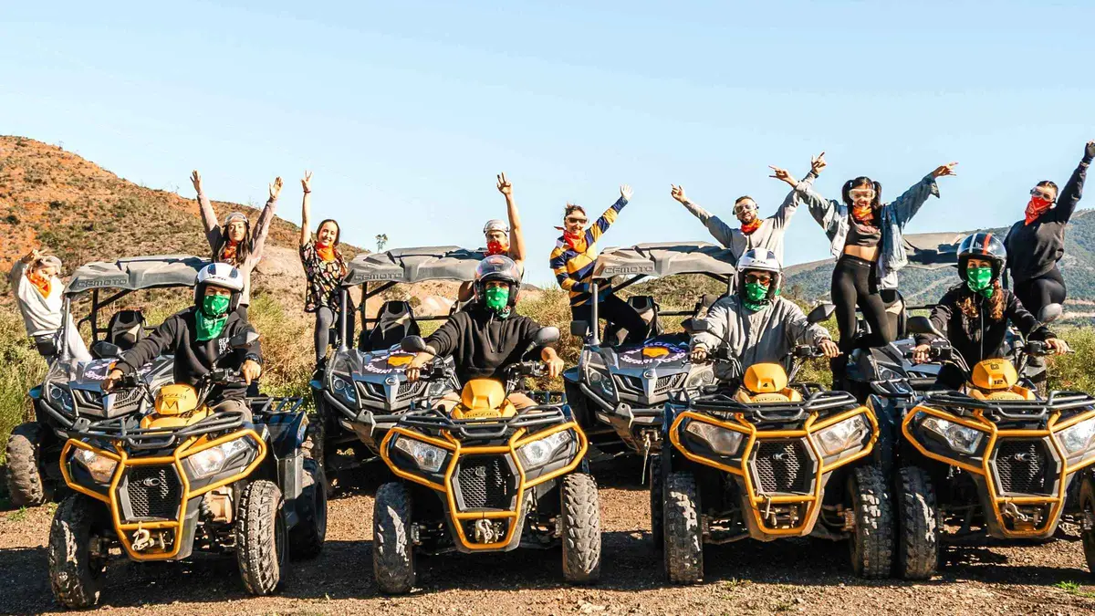 Two riders on a quad bike on a dirt track above Fuengirola on a guided quad tour in the Mijas mountains near Málaga